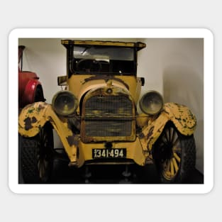 The yellow rusty vintage car Sticker